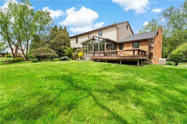 4117 Kellington Ct, Murrysville, PA 15668 - rear view of property with a sunroom, a chimney, a lawn, and brick siding