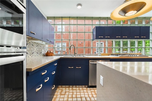 2219 Beechwood Blvd, Squirrel Hill, PA 15217 - kitchen featuring a sink, appliances with stainless steel finishes, blue cabinetry, tasteful backsplash, and light countertops