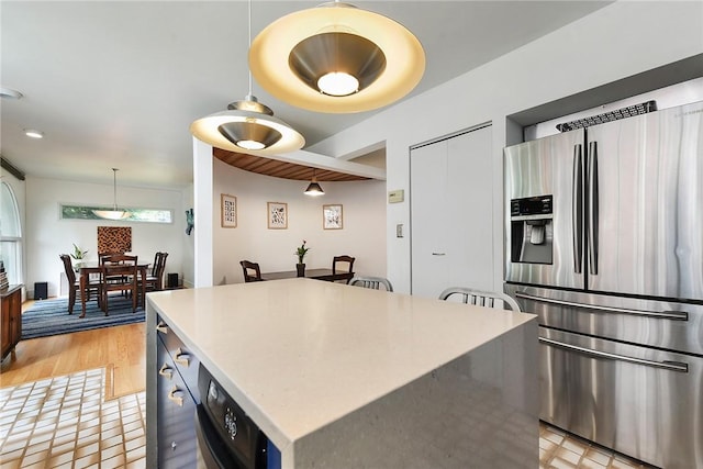 2219 Beechwood Blvd, Squirrel Hill, PA 15217 - kitchen featuring stainless steel fridge with ice dispenser, a center island, pendant lighting, light countertops, and light wood-type flooring