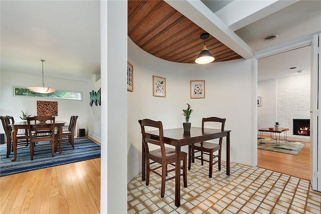 2219 Beechwood Blvd, Squirrel Hill, PA 15217 - dining area with wood finished floors, a fireplace, and beam ceiling