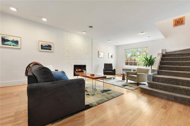 2219 Beechwood Blvd, Squirrel Hill, PA 15217 - living room with light wood-type flooring, stairway, a fireplace, baseboards, and recessed lighting