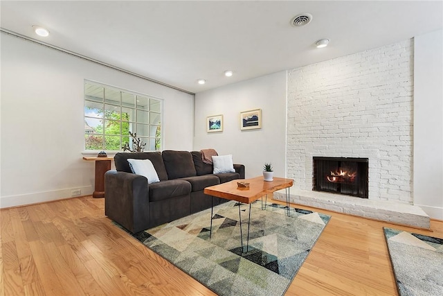 2219 Beechwood Blvd, Squirrel Hill, PA 15217 - living area with wood finished floors, a stone fireplace, baseboards, and recessed lighting