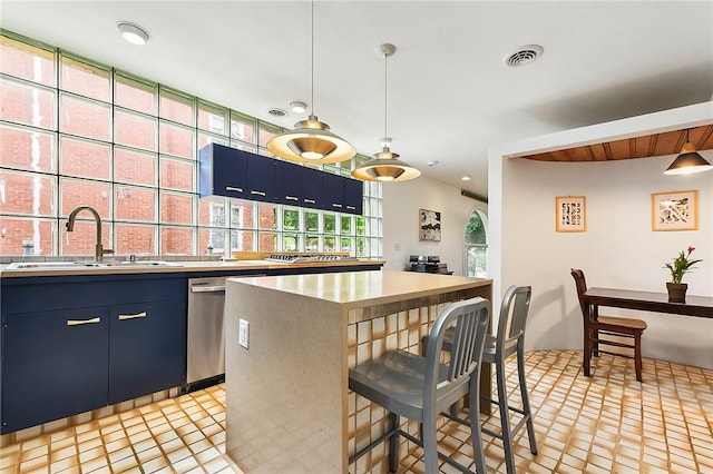 2219 Beechwood Blvd, Squirrel Hill, PA 15217 - kitchen with a sink, blue cabinets, a breakfast bar area, light countertops, and recessed lighting