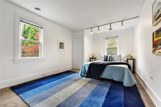 2219 Beechwood Blvd, Squirrel Hill, PA 15217 - bedroom with track lighting, dark colored carpet, and baseboards