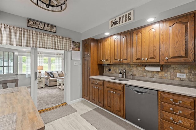 1509 Ingomar Heights Rd, Franklin Park, PA 15237 - kitchen featuring stainless steel dishwasher, a sink, light countertops, and brown cabinets