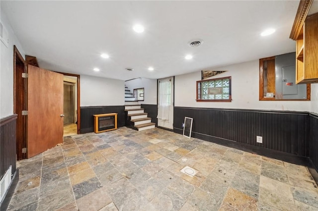914 Western Ave, Jeannette, PA 15644 - below grade area with stone tile floors, wainscoting, recessed lighting, stairs, and wooden walls