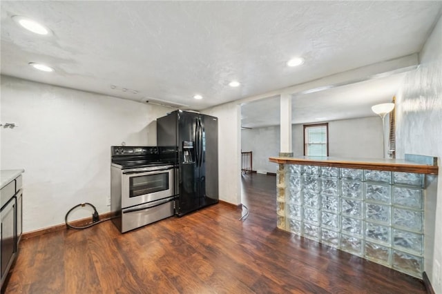 914 Western Ave, Jeannette, PA 15644 - kitchen with stainless steel electric stove, black refrigerator with ice dispenser, dark wood finished floors, baseboards, and recessed lighting