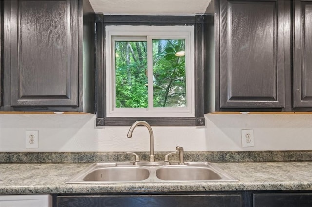 914 Western Ave, Jeannette, PA 15644 - kitchen with a sink, dark brown cabinets, and light countertops