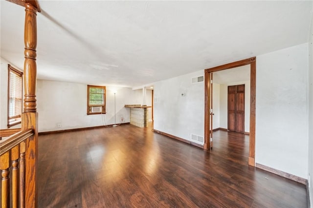914 Western Ave, Jeannette, PA 15644 - empty room featuring wood finished floors, baseboards, and cooling unit