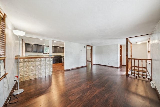 914 Western Ave, Jeannette, PA 15644 - unfurnished living room with dark wood-type flooring and baseboard heating