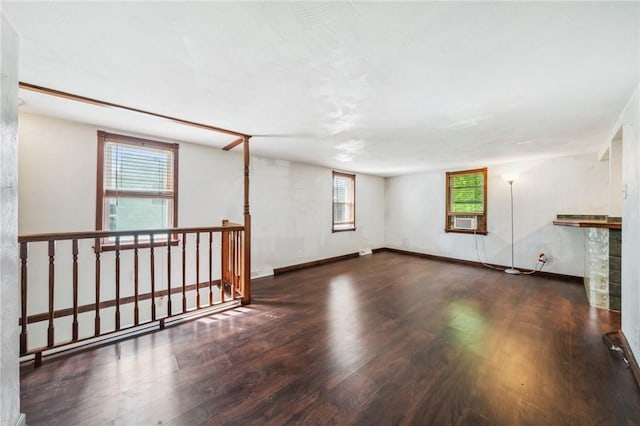 914 Western Ave, Jeannette, PA 15644 - unfurnished living room with wood finished floors, plenty of natural light, and cooling unit