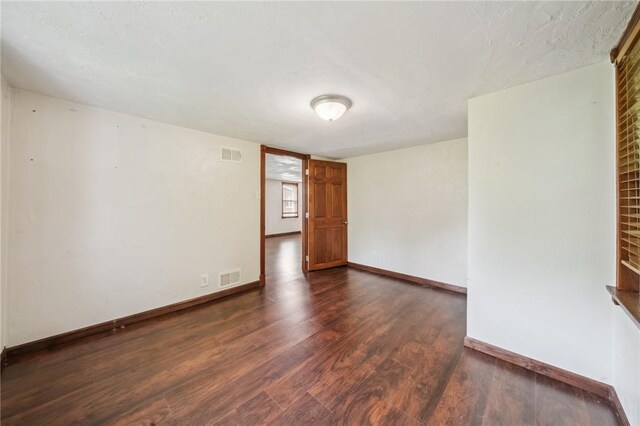 914 Western Ave, Jeannette, PA 15644 - unfurnished room with dark wood finished floors and baseboards