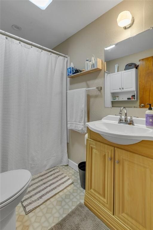 9895 Willow Dr, Mccandless, PA 15090 - bathroom with toilet, vanity, tile patterned floors, and curtained shower
