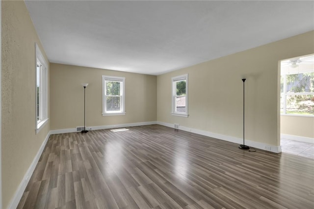 9895 Willow Dr, Mccandless, PA 15090 - spare room with healthy amount of natural light, wood finished floors, and baseboards