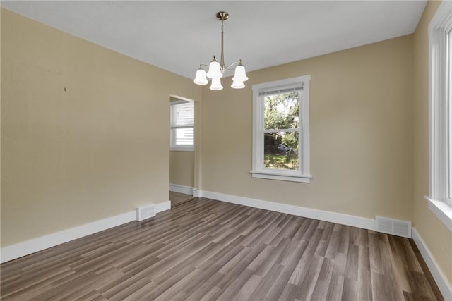 9895 Willow Dr, Mccandless, PA 15090 - unfurnished room featuring a chandelier, wood finished floors, and baseboards