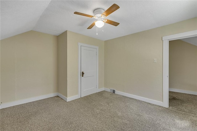 9895 Willow Dr, Mccandless, PA 15090 - additional living space featuring carpet flooring, a ceiling fan, a textured ceiling, lofted ceiling, and baseboards