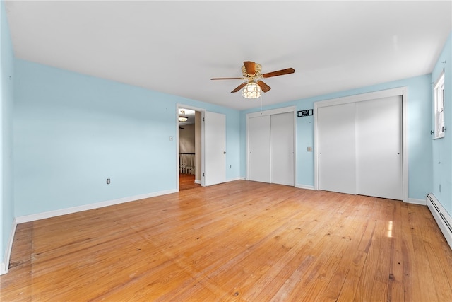 271 Harbison Rd, Buffalo Twp But, PA 16055 - unfurnished bedroom featuring multiple closets, light wood finished floors, baseboard heating, and baseboards