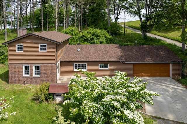 271 Harbison Rd, Buffalo Twp But, PA 16055 - view of front facade featuring a chimney, brick siding, concrete driveway, a front lawn, and roof with shingles
