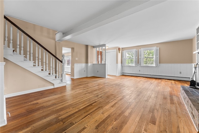 271 Harbison Rd, Buffalo Twp But, PA 16055 - unfurnished living room with baseboard heating, hardwood / wood-style floors, a wainscoted wall, and stairs