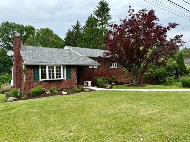 2612 Saybrook Dr, Churchill Boro, PA 15235 - view of front of property with a front yard, a chimney, brick siding, and a shingled roof