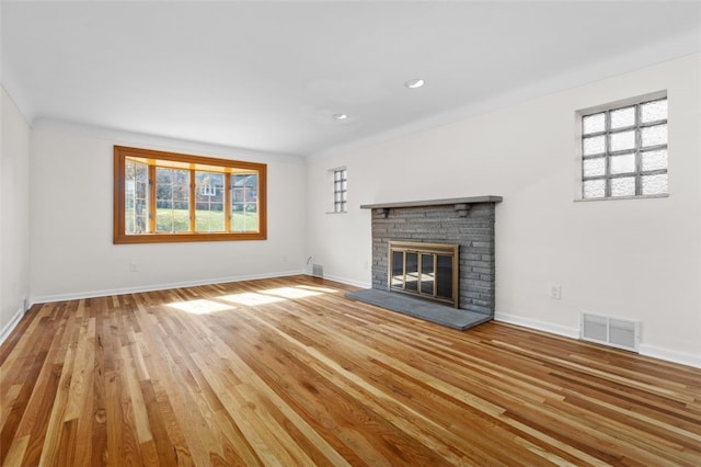 2612 Saybrook Dr, Churchill Boro, PA 15235 - unfurnished living room with plenty of natural light, a fireplace, baseboards, wood finished floors, and recessed lighting