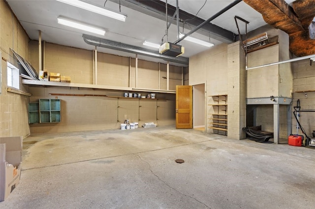 2612 Saybrook Dr, Churchill Boro, PA 15235 - garage with a garage door opener and concrete block wall