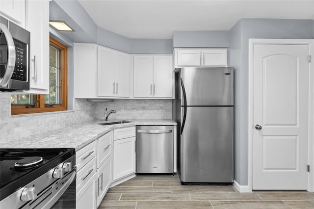 2612 Saybrook Dr, Churchill Boro, PA 15235 - kitchen with stainless steel appliances, a sink, and white cabinets