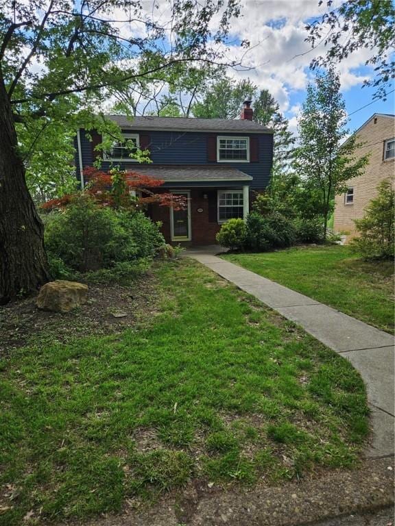 227 Ridge Ave, Forest Hills Boro, PA 15221 - view of front of house with a chimney and a front lawn