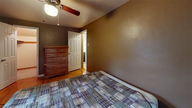 227 Ridge Ave, Forest Hills Boro, PA 15221 - bedroom with wood finished floors, a ceiling fan, a closet, and a spacious closet