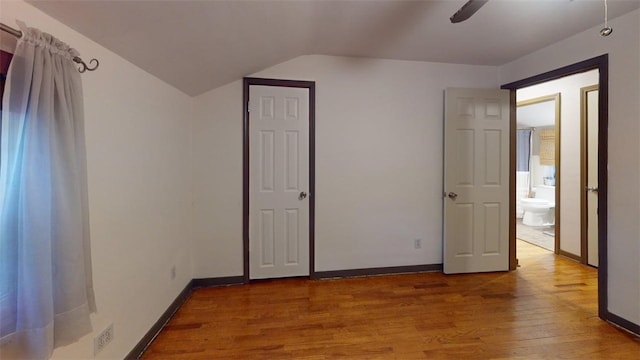227 Ridge Ave, Forest Hills Boro, PA 15221 - unfurnished bedroom featuring wood finished floors, vaulted ceiling, baseboards, and ceiling fan