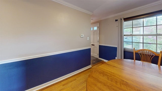 227 Ridge Ave, Forest Hills Boro, PA 15221 - dining space featuring crown molding, plenty of natural light, baseboards, and wood finished floors
