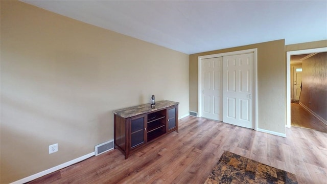 227 Ridge Ave, Forest Hills Boro, PA 15221 - unfurnished bedroom with light wood-style floors, baseboards, and a closet