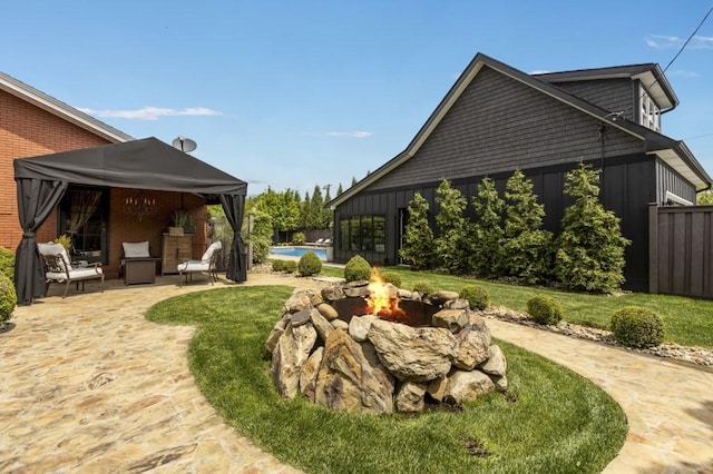 1511 Corporation St, Beaver, PA 15009 - view of green lawn featuring an outdoor fire pit, a patio area, and an outdoor pool