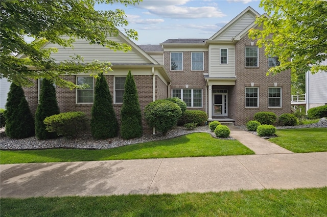 821 Westminster Ln, Cranberry Twp, PA 16066 - view of front of home with brick siding and a front lawn
