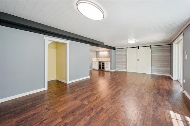 821 Westminster Ln, Cranberry Twp, PA 16066 - unfurnished living room featuring beverage cooler, wood finished floors, baseboards, and a barn door