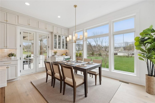 205 Rothaar Ct, Peters Twp, PA 15367 - dining room featuring french doors, light wood-type flooring, recessed lighting, and a chandelier