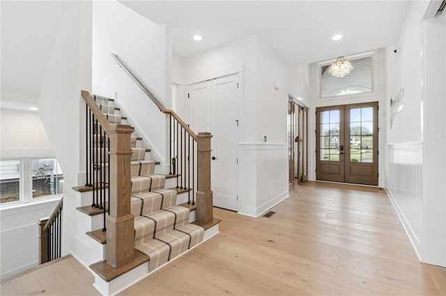 205 Rothaar Ct, Peters Twp, PA 15367 - entrance foyer featuring stairs, light wood-style floors, a chandelier, french doors, and recessed lighting