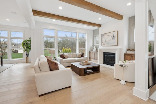 205 Rothaar Ct, Peters Twp, PA 15367 - living room with beamed ceiling, a glass covered fireplace, light wood-style floors, and recessed lighting