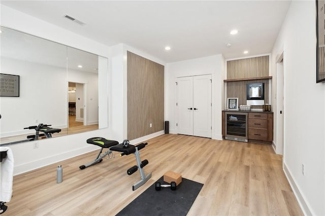 205 Rothaar Ct, Peters Twp, PA 15367 - workout room with wine cooler, light wood-style floors, recessed lighting, and baseboards