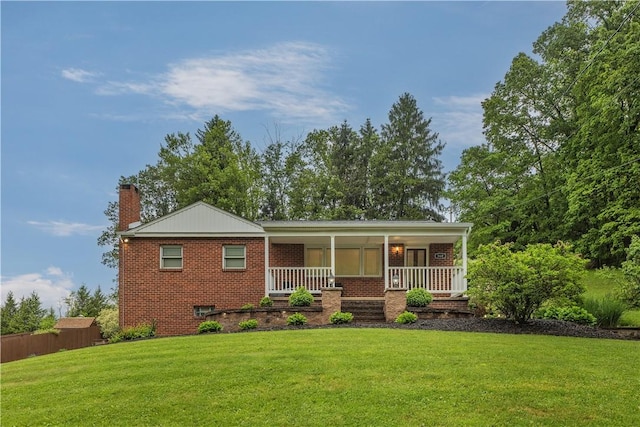 360 Orr Ave, Allegheny Twp, PA 15613 - ranch-style home featuring a chimney, brick siding, a front lawn, and a porch