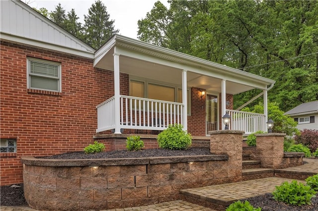 360 Orr Ave, Allegheny Twp, PA 15613 - view of front of house featuring brick siding, board and batten siding, and covered porch