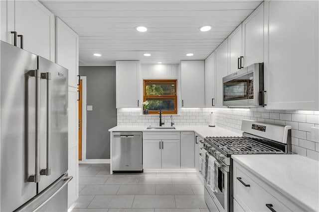 360 Orr Ave, Allegheny Twp, PA 15613 - kitchen with stainless steel appliances, tasteful backsplash, light countertops, recessed lighting, and white cabinetry