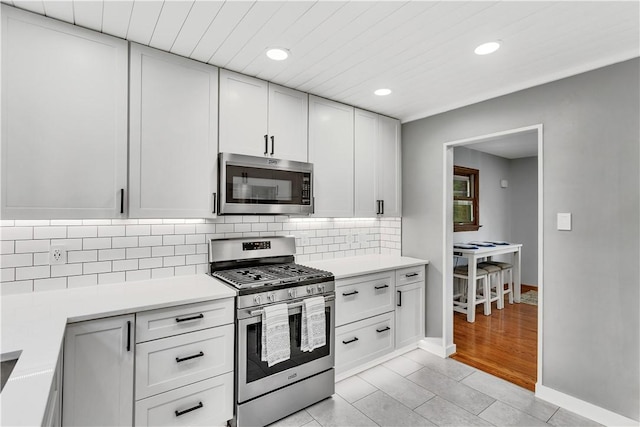360 Orr Ave, Allegheny Twp, PA 15613 - kitchen featuring appliances with stainless steel finishes, recessed lighting, light countertops, tasteful backsplash, and white cabinetry