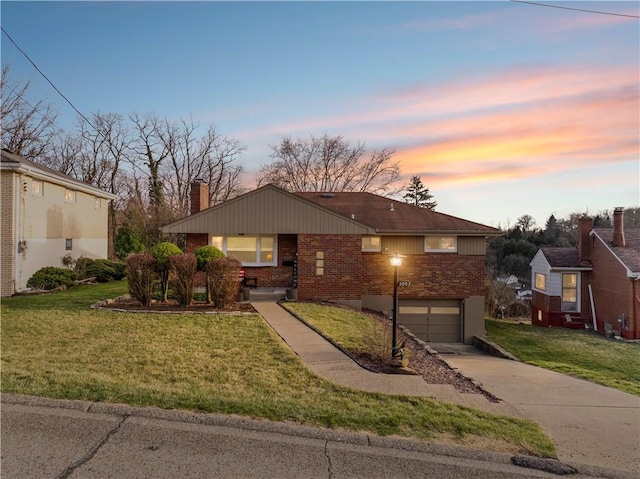 2092 Arnold Acres Dr, Banksville/Westwood, PA 15205 - view of front facade with brick siding, a chimney, concrete driveway, a garage, and a lawn