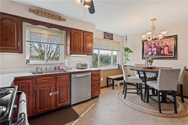 2092 Arnold Acres Dr, Banksville/Westwood, PA 15205 - kitchen with stainless steel appliances, a sink, a chandelier, decorative light fixtures, and light tile patterned flooring