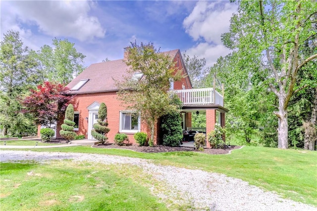 5125 Curry Rd, Baldwin Boro, PA 15236 - view of front of property with a balcony, brick siding, and a front yard