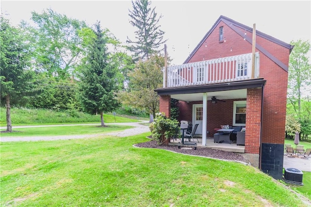 5125 Curry Rd, Baldwin Boro, PA 15236 - rear view of house featuring a balcony, a ceiling fan, a yard, and a patio