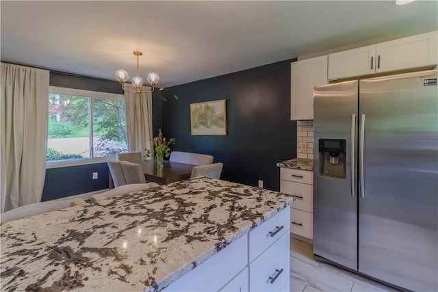 5125 Curry Rd, Baldwin Boro, PA 15236 - kitchen featuring stainless steel fridge with ice dispenser, a chandelier, white cabinets, and light stone countertops
