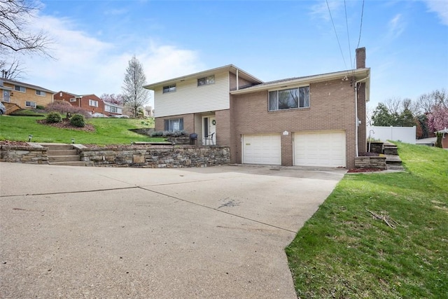 1111 Oriole Dr, Green Tree, PA 15220 - view of front of home featuring a chimney, brick siding, an attached garage, concrete driveway, and a front lawn