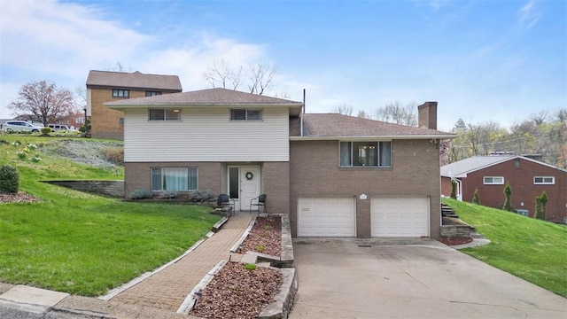 1111 Oriole Dr, Green Tree, PA 15220 - tri-level home with brick siding, a chimney, driveway, a front lawn, and an attached garage